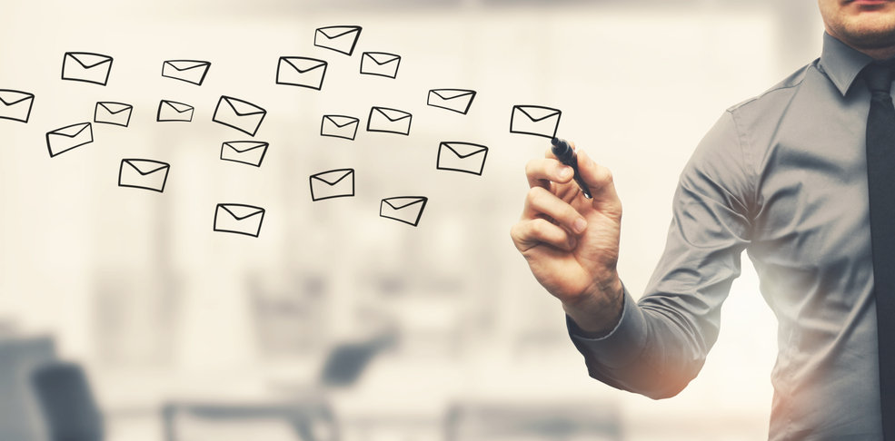 person drawing envelopes