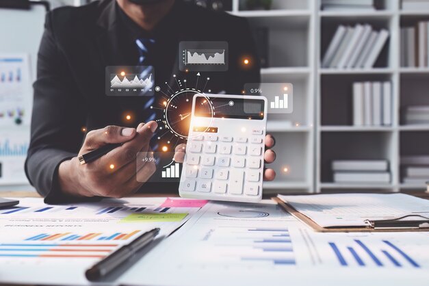 person pointing at calculator for budgeting